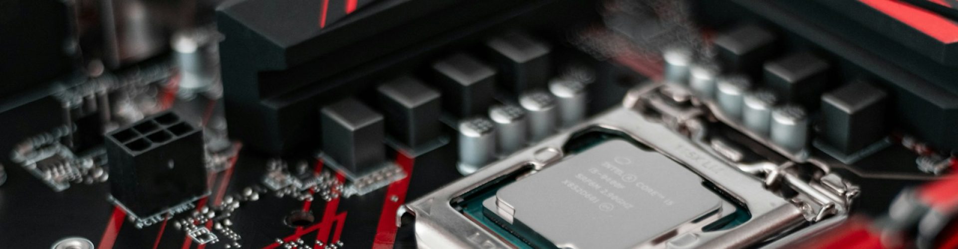 gray and green computer processor and black motherboard